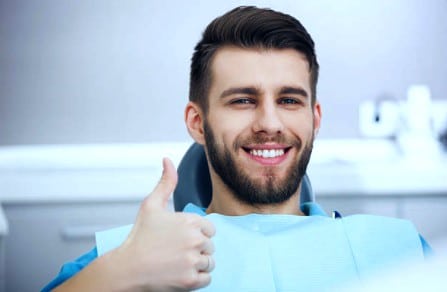 Happy patient after teeth cleaning from Oxnard dentist Carson & Carson, DDS.