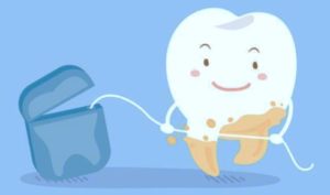 Limpieza dental en sí con hilo dental. Carson & Carson, DDS en Oxnard, California.