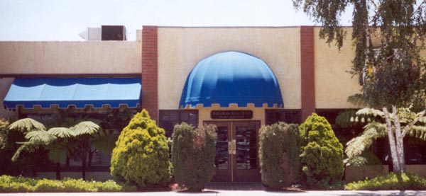 Characteristic blue awnings of the Carson & Carson DDS office in Oxnard